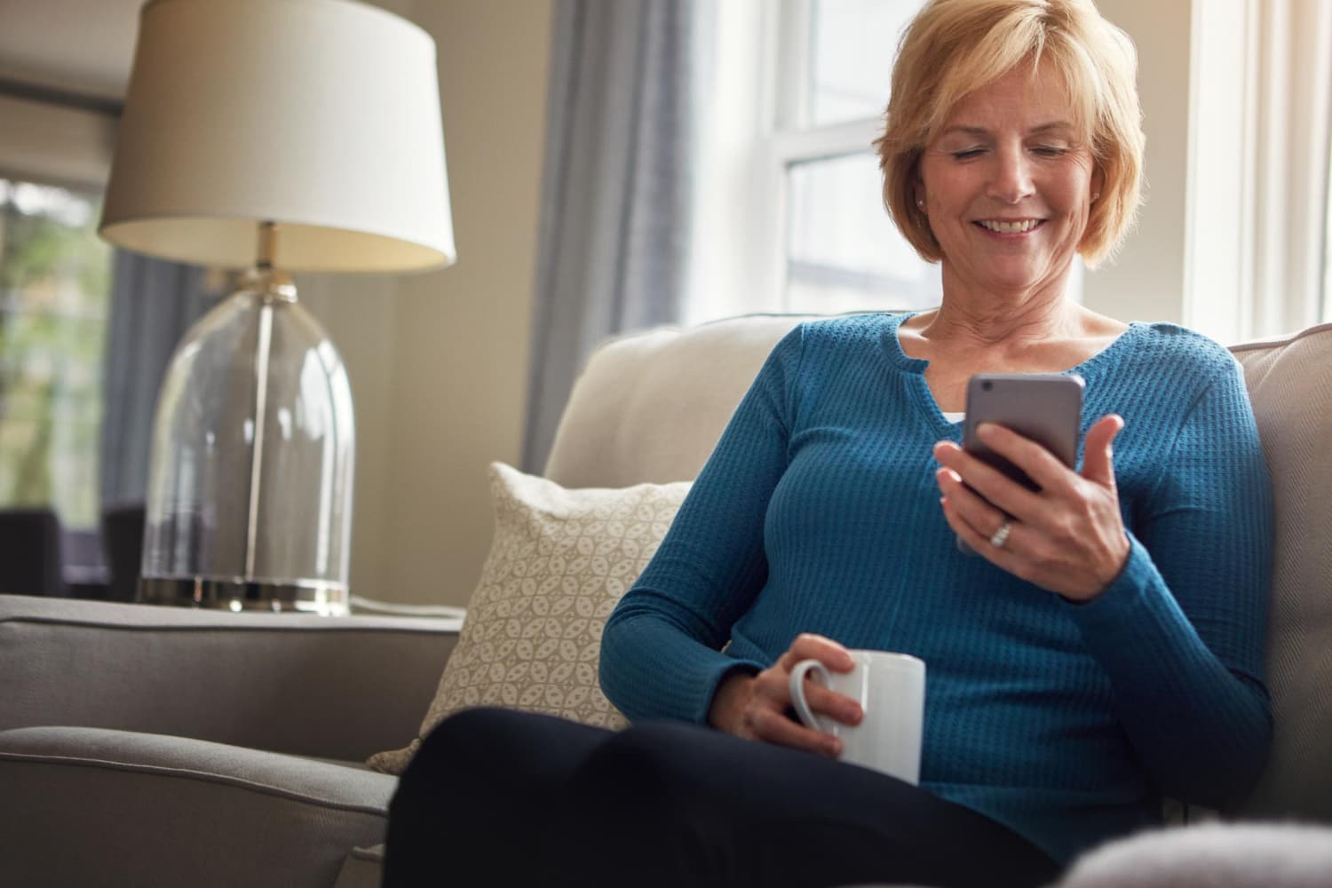 Member booking a ride on her phone